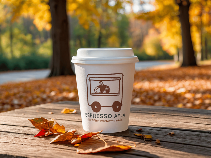 Branded cup in autumn park with leaves